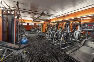 A gym with a variety of exercise equipment, conveniently located near Apartments in Valley Village CA.